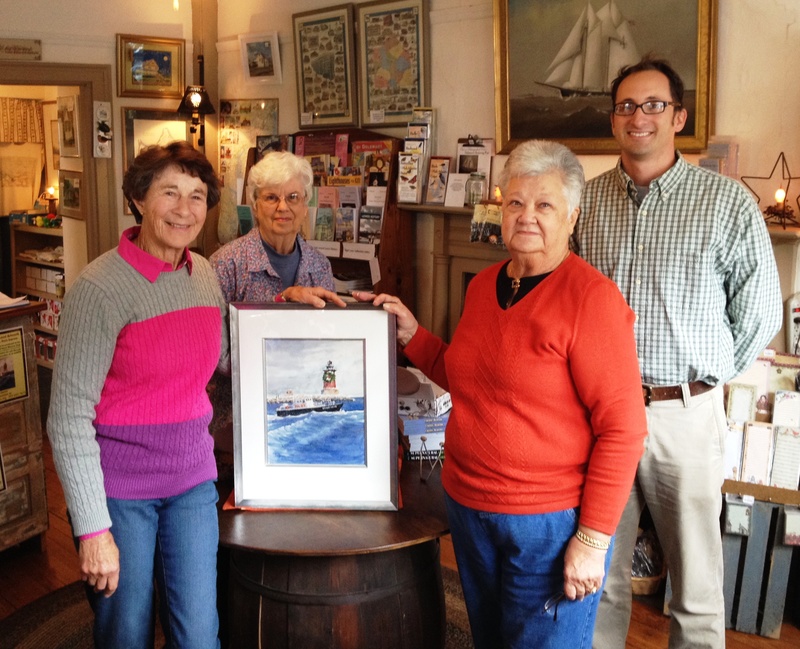 Artist Doris Ingram, left, presents a beautiful original watercolor painting to The Lewes Historical Society for a benefit raffle and for use of the image on the 2014 Christmas Tour of Lewes ticket cover. Also shown are (l-r) LHS Gift Shop Manager Suzanne Jones, LHS Board President Ann Hilaman, and LHS Executive Director Mike DiPaolo. SOURCE SUBMITTED